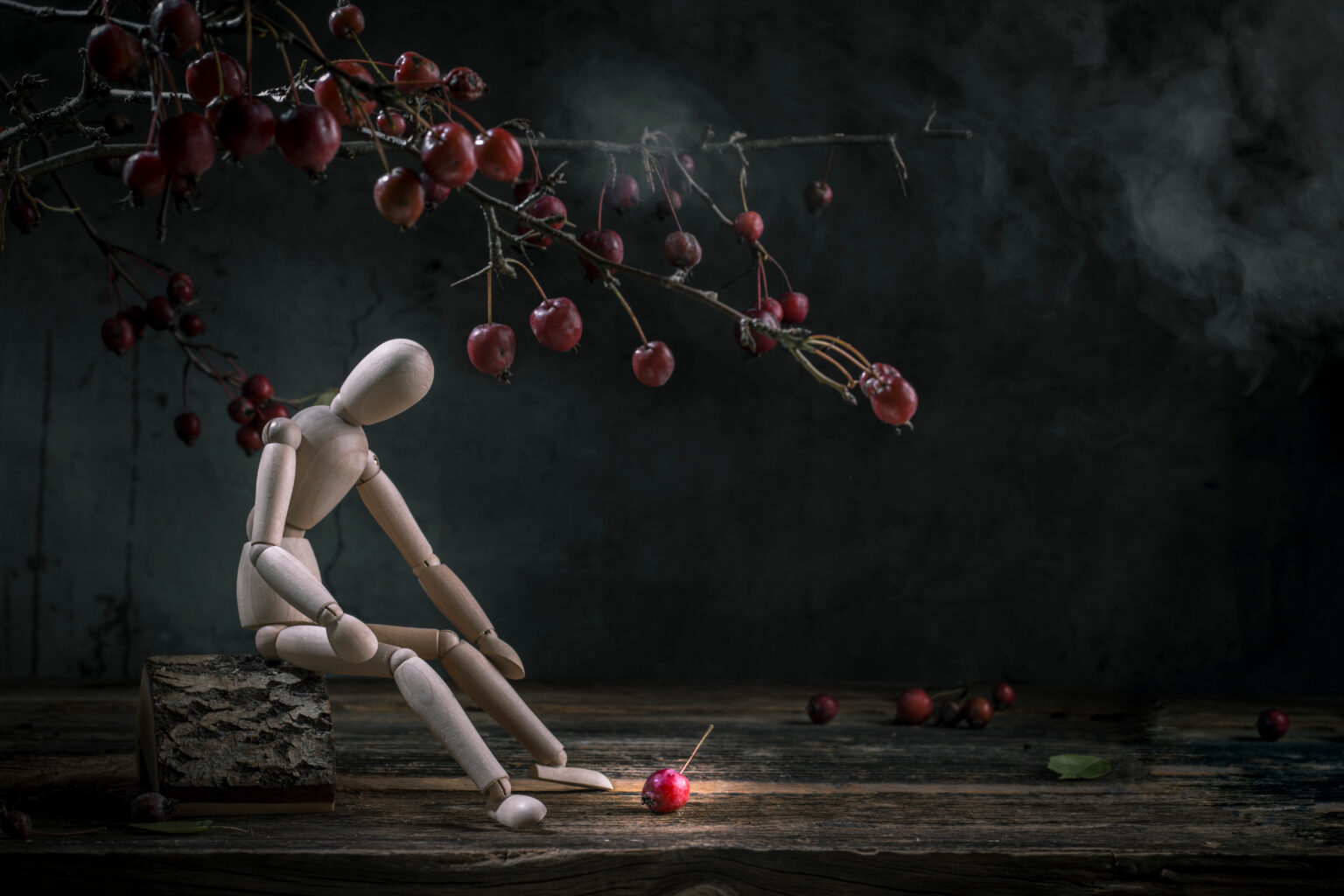Apple falling off a tree near person