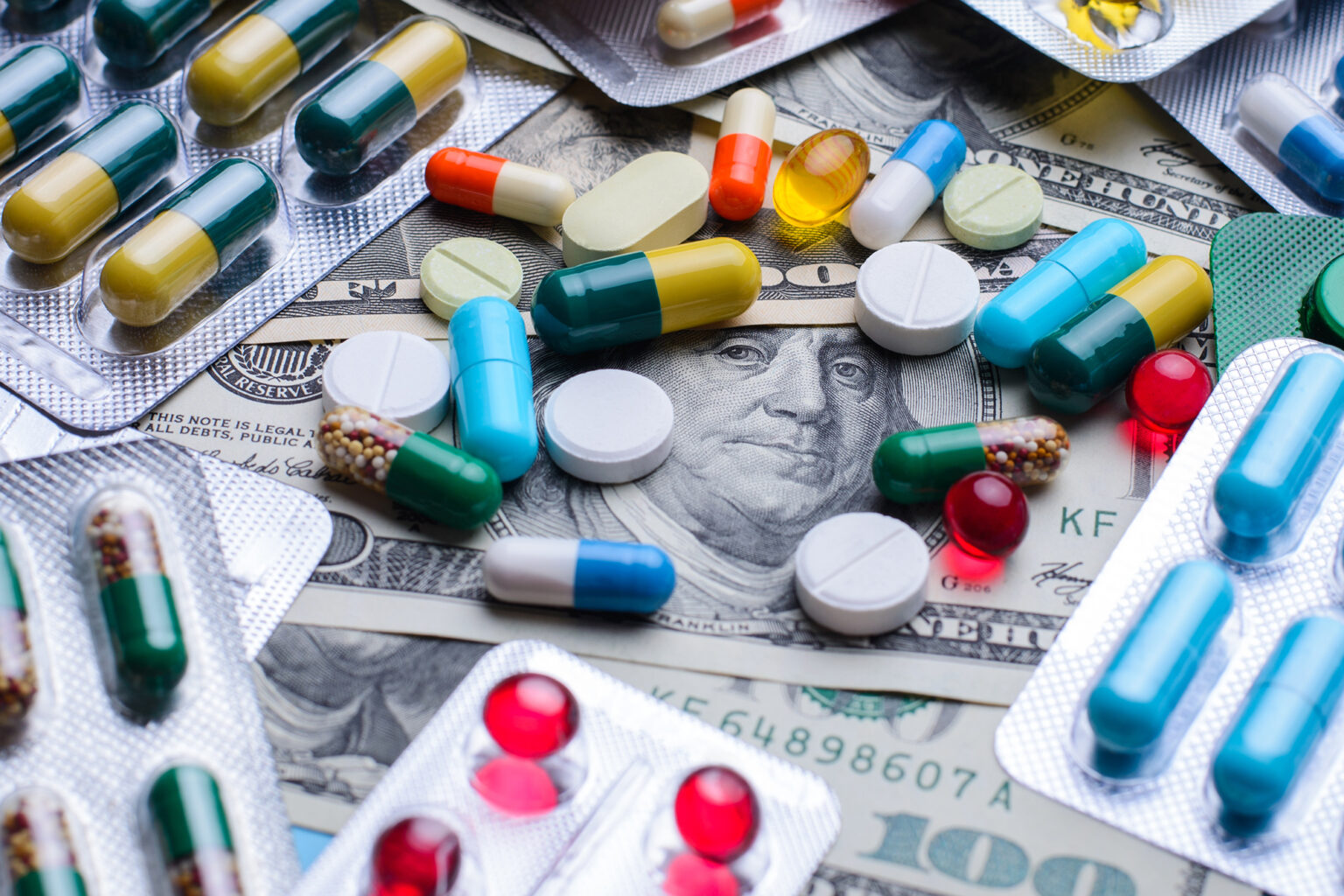 Prescription drugs on a money banknotes. Concept of healthcare costs