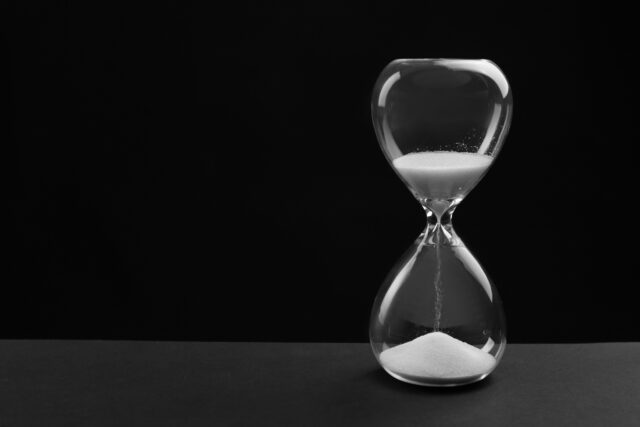 Hourglass on black background