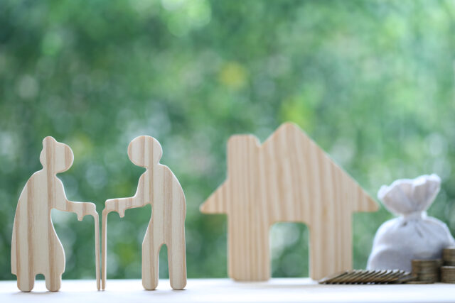 Mutual fund,Love couple senior and model house on natural green background, Save money for prepare in future and pension retirement concept