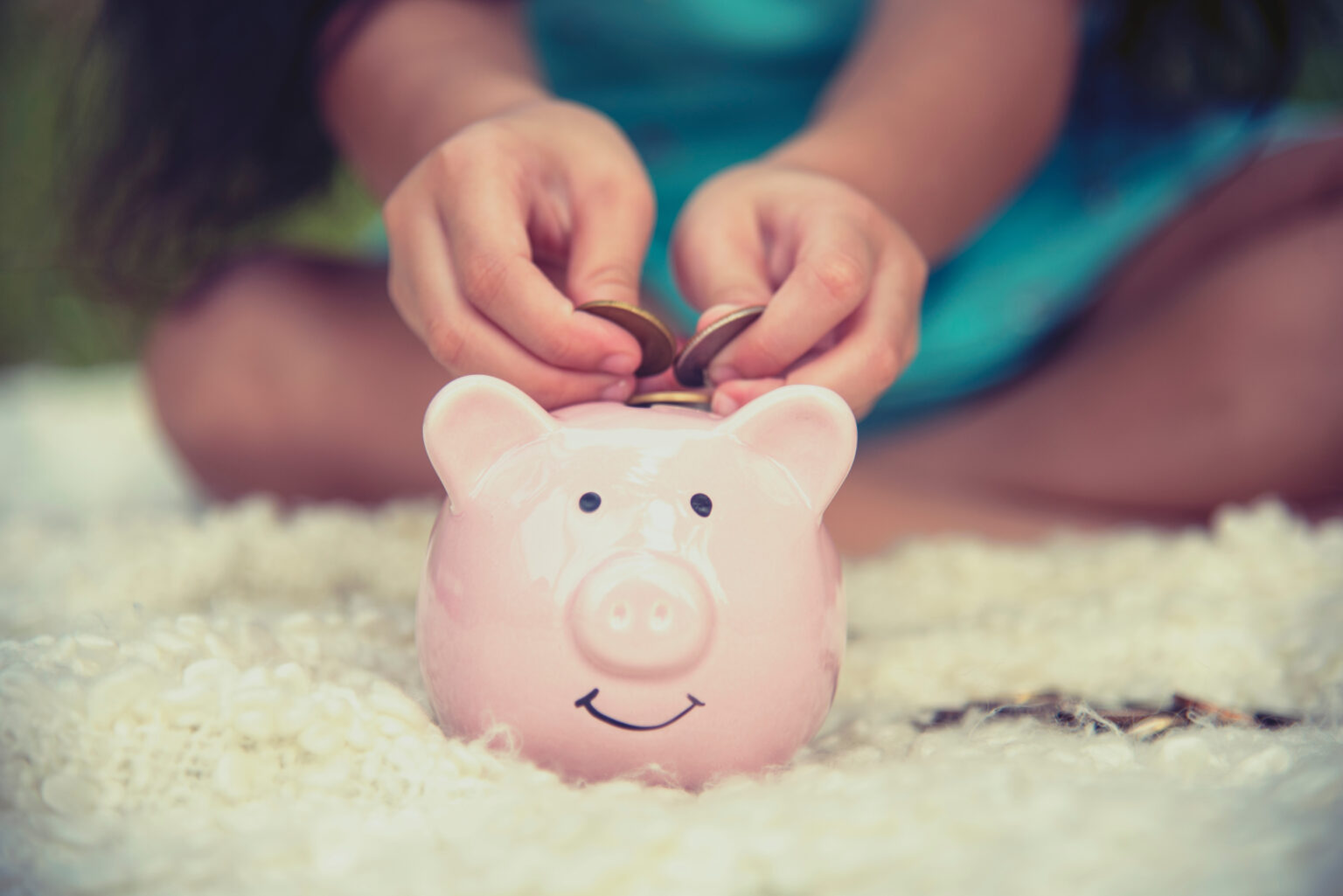 Adorable kids saving coins in piggy bank. Happy little investment saving money for happiness future. Girls smiling with happy face