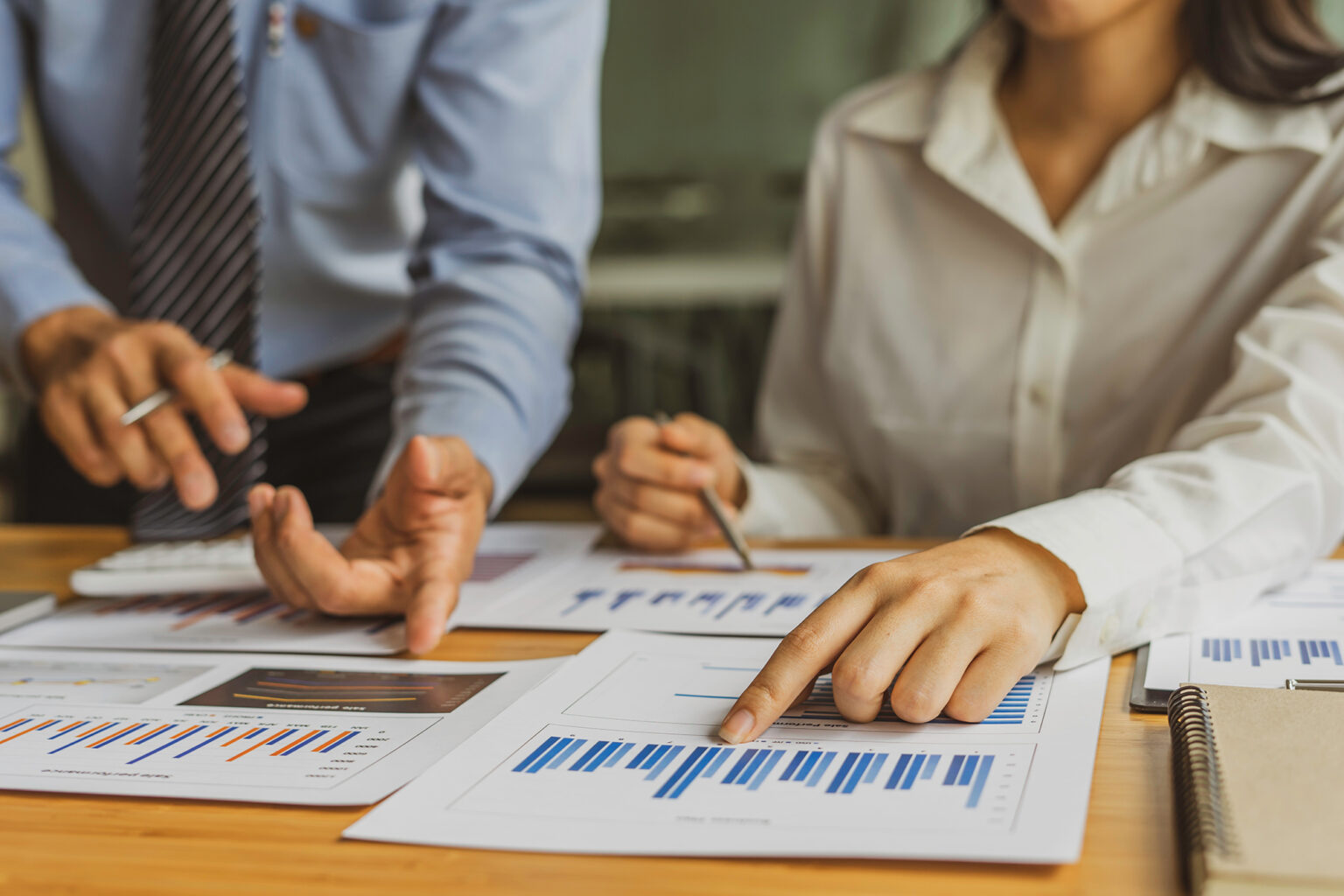 Business people analyzing financial documents