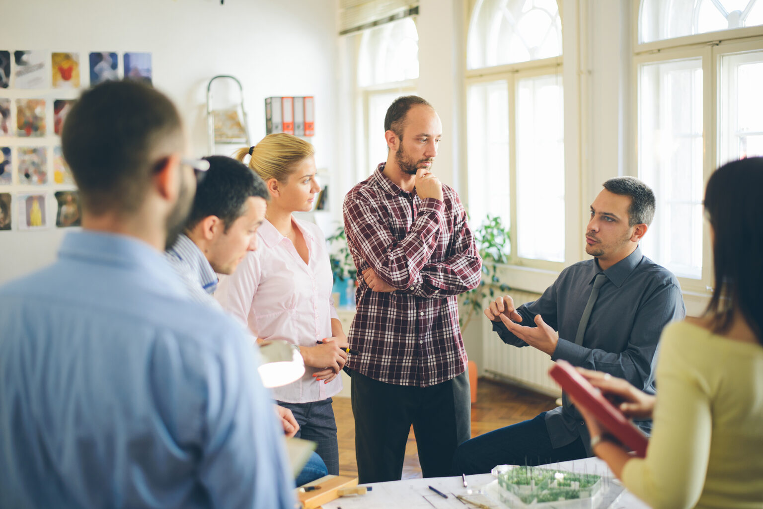Group of professionals engaged in a conversation