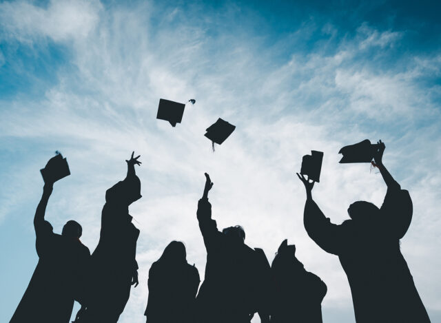 Silhouettes of students Celebrating Graduation