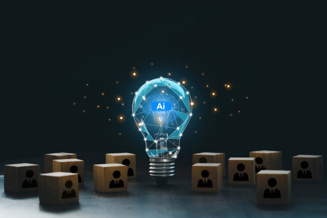 AI with a digital brain in a lightbulb with human icons in wooden blocks for AI vs human competition